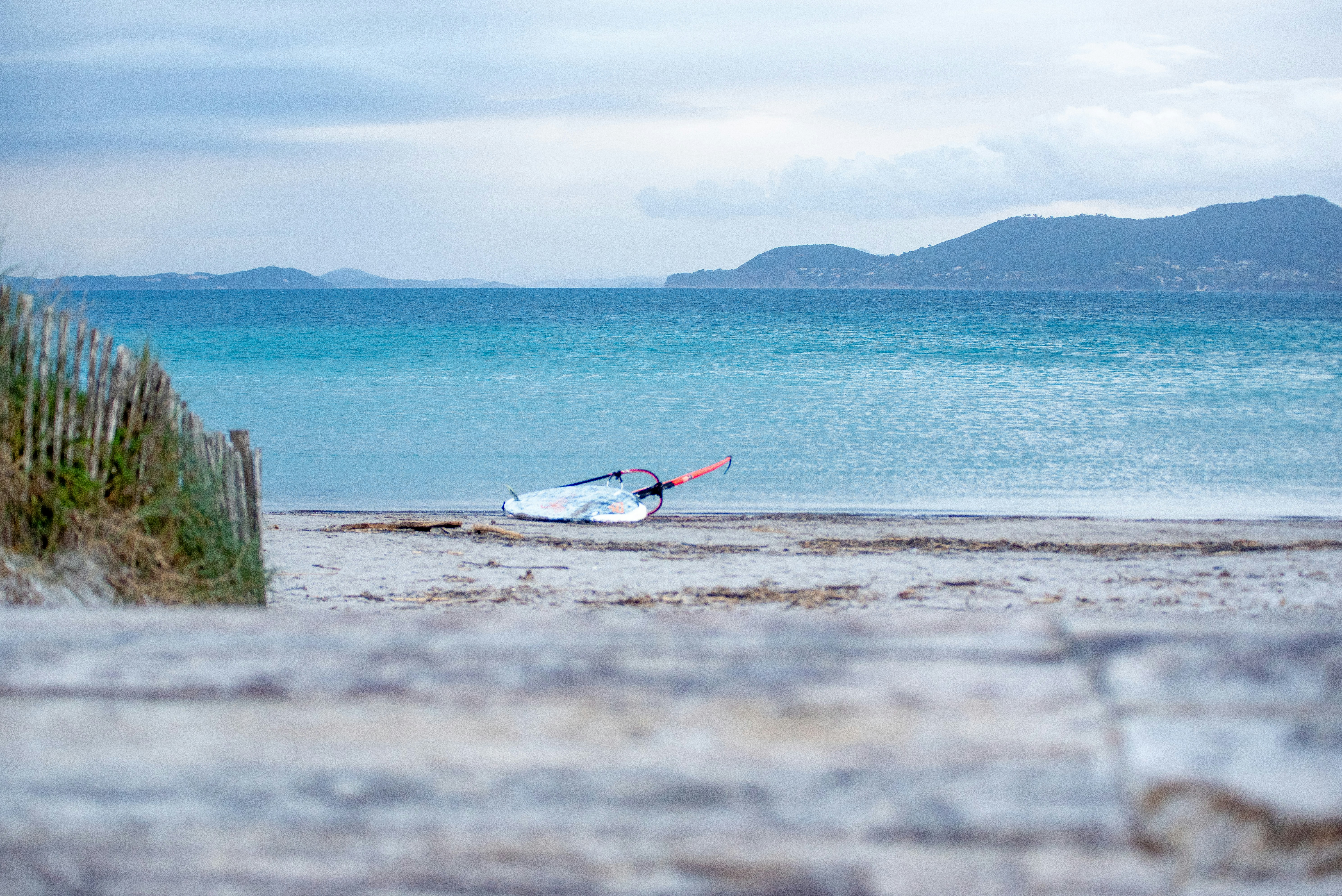 a small boat is sitting on the beach