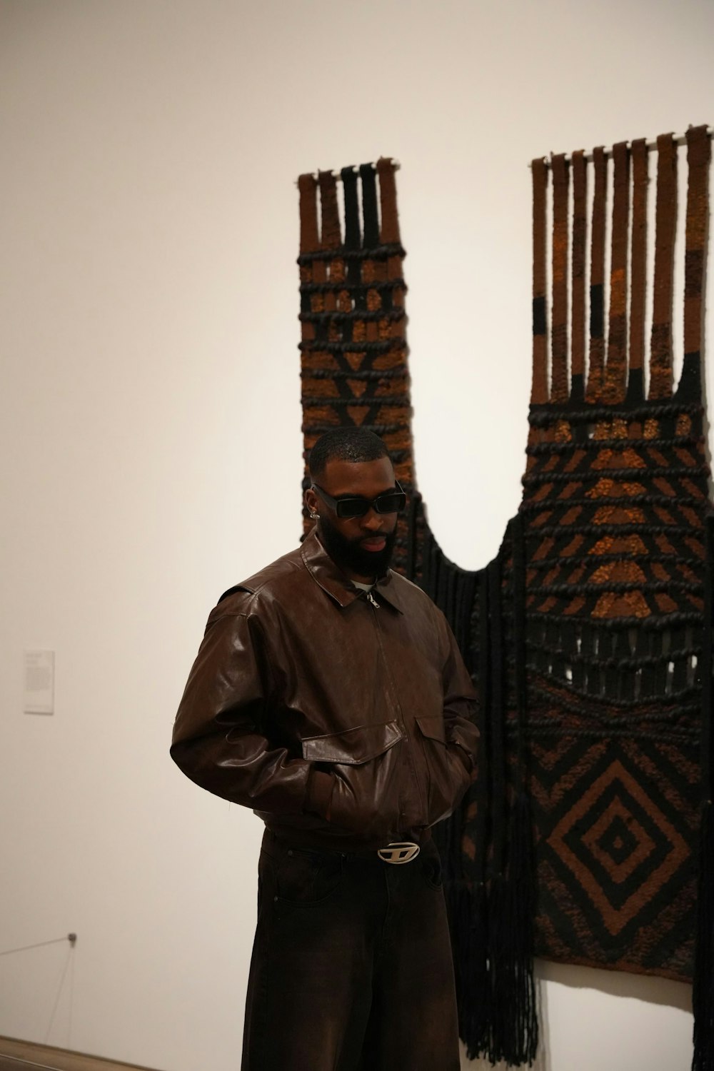 a man is standing in front of some art