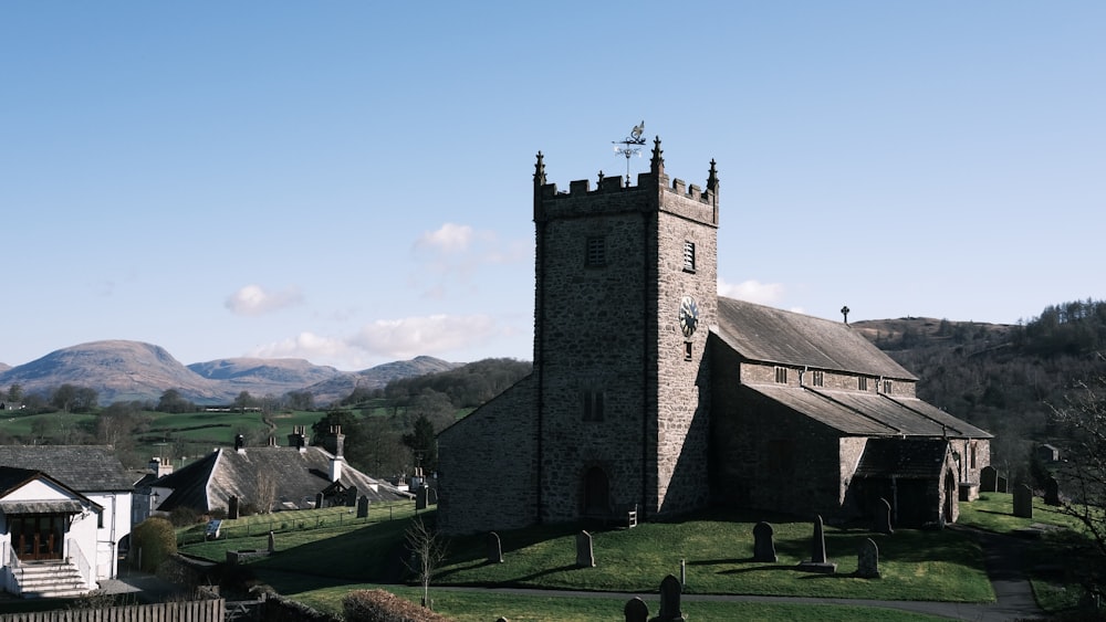 a church with a steeple on a hill