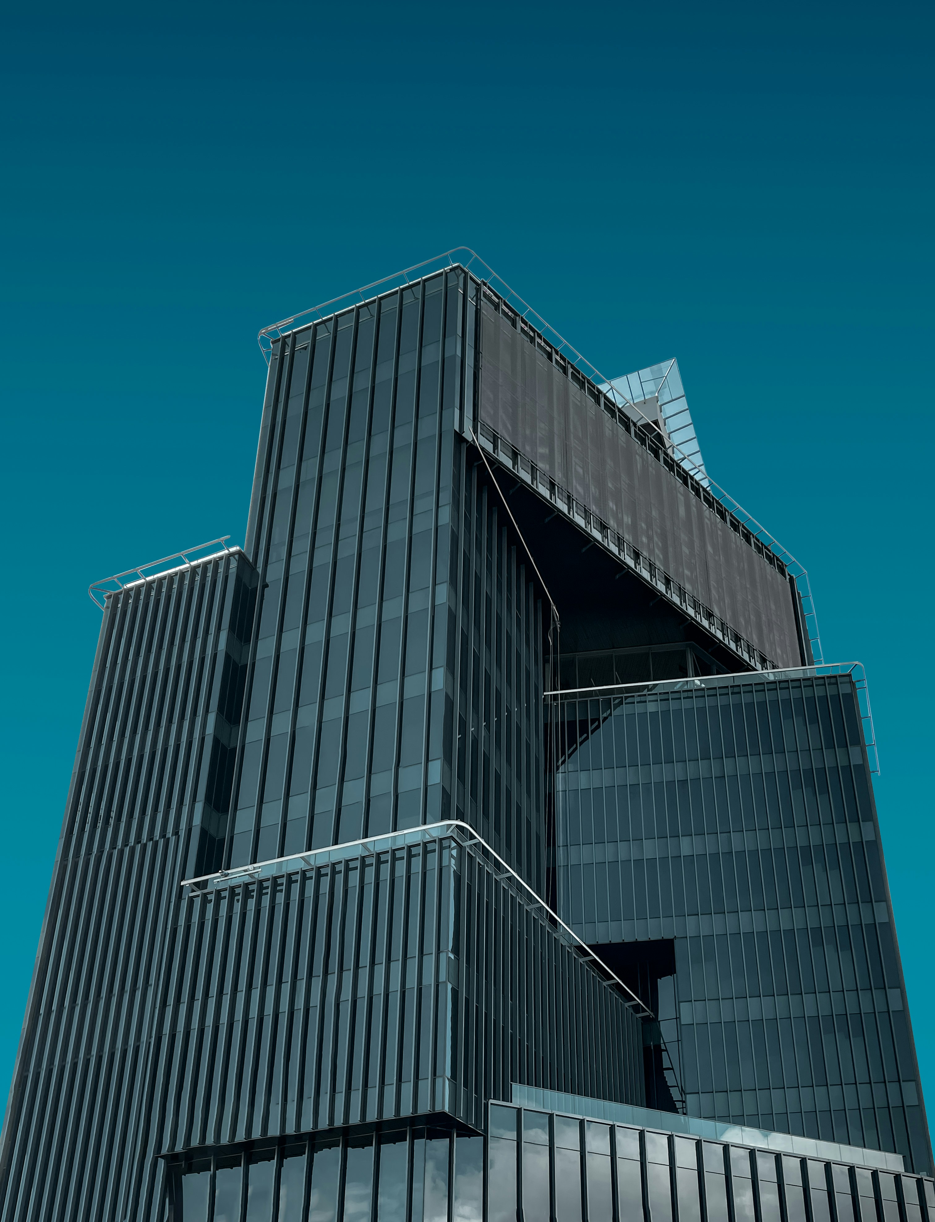 a very tall building with a clock on it's side