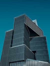 a very tall building with a clock on it's side