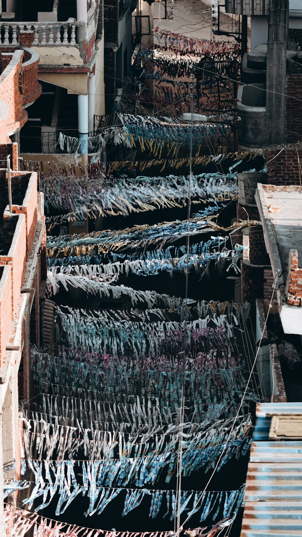 a bunch of clothes that are hanging on a line