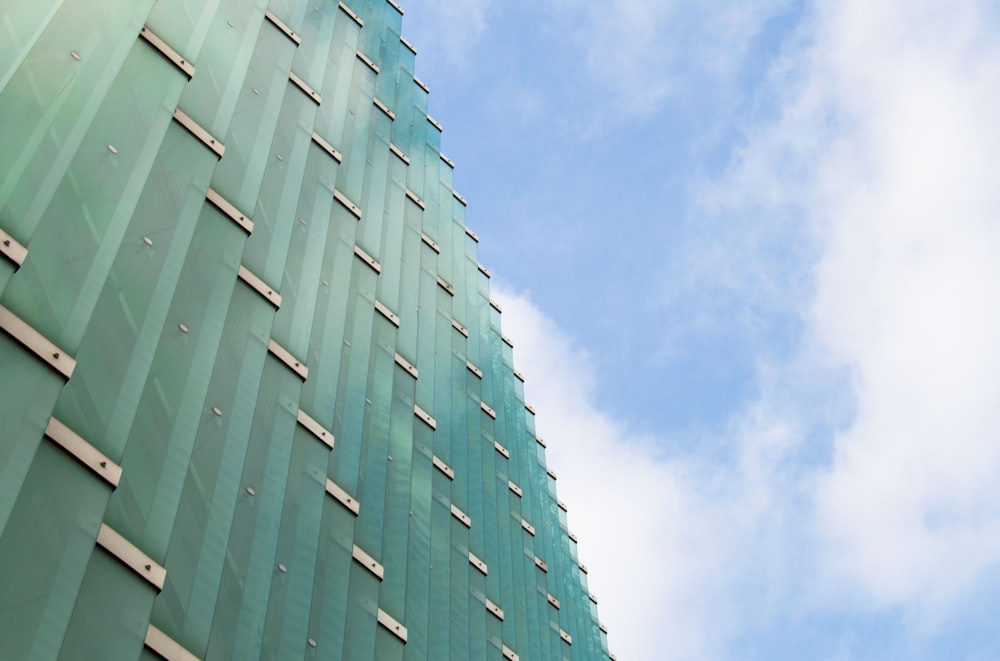 a tall building with a blue sky in the background