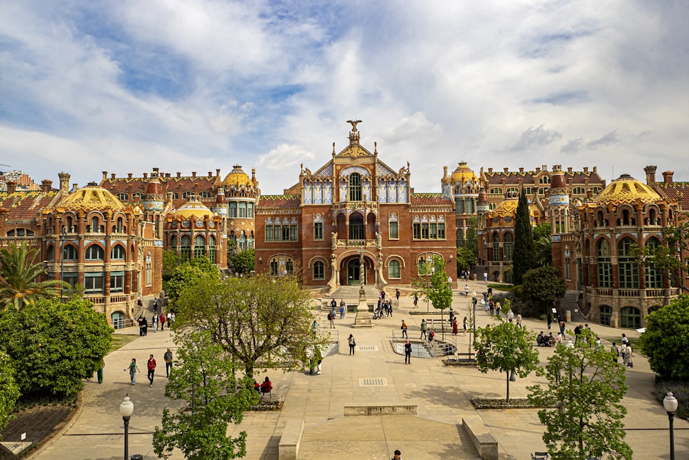 a large building with a lot of people walking around it