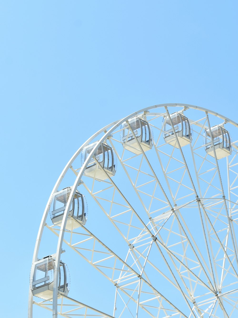 a ferris wheel with a blue sky in the background