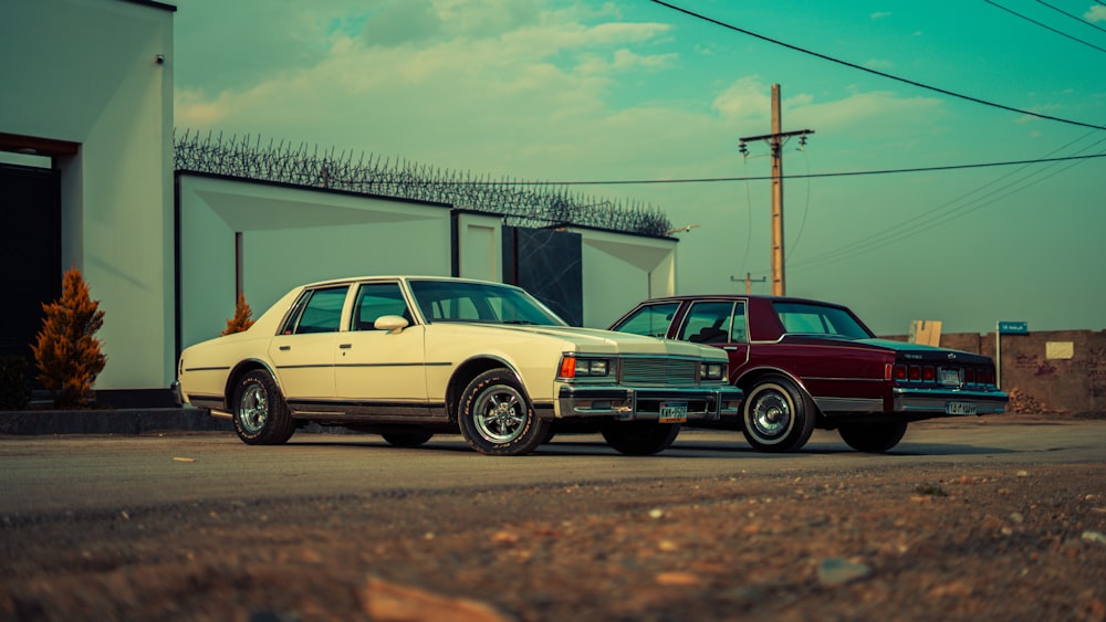 two cars parked in front of a building