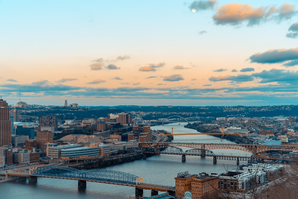 a view of a city with a bridge in the foreground