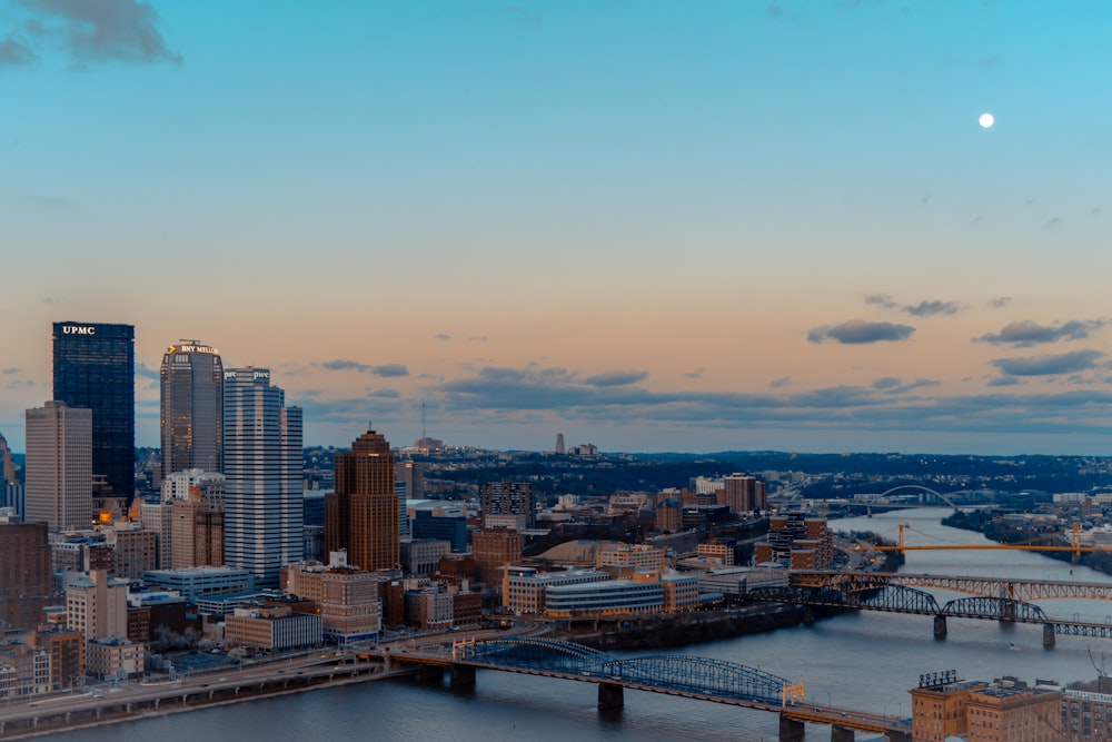 a view of a city with a bridge in the foreground