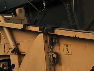 a close up of the side of a yellow dump truck