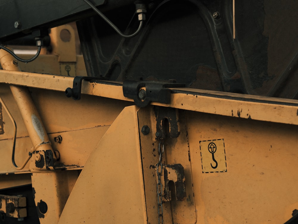 a close up of the side of a yellow dump truck