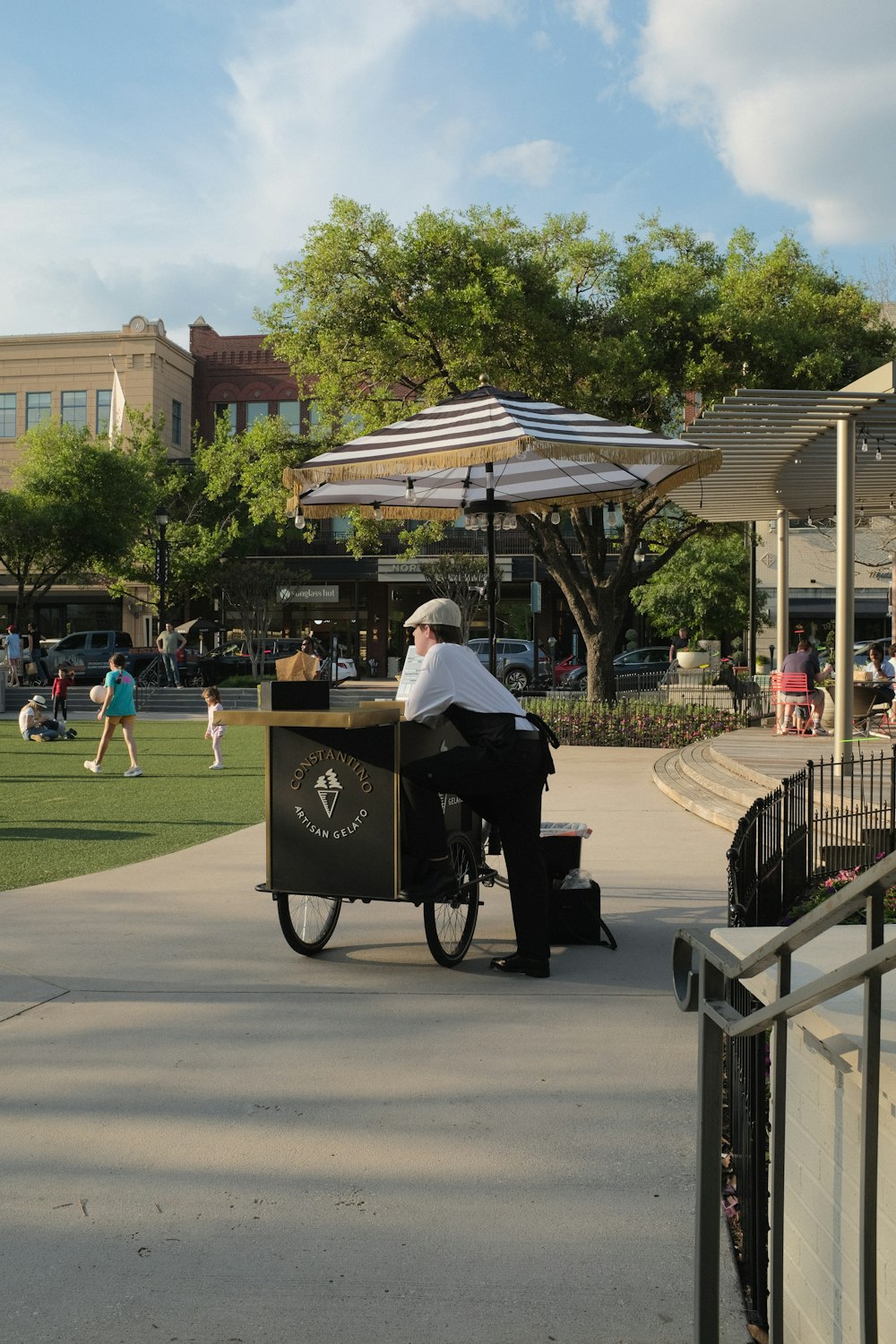 a man sitting at a table in a park