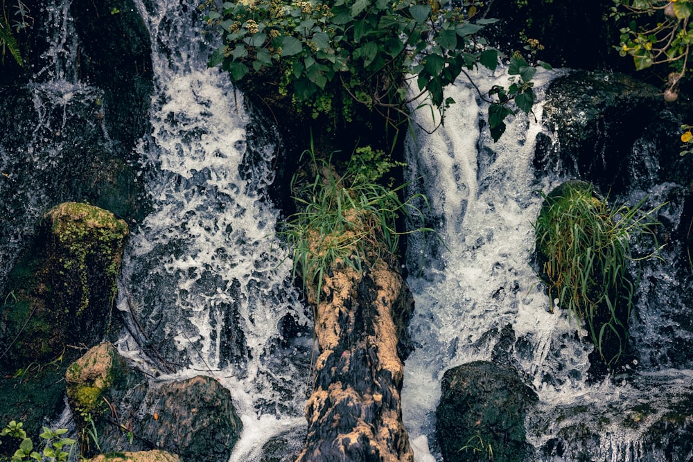 a waterfall with water cascading down it's sides