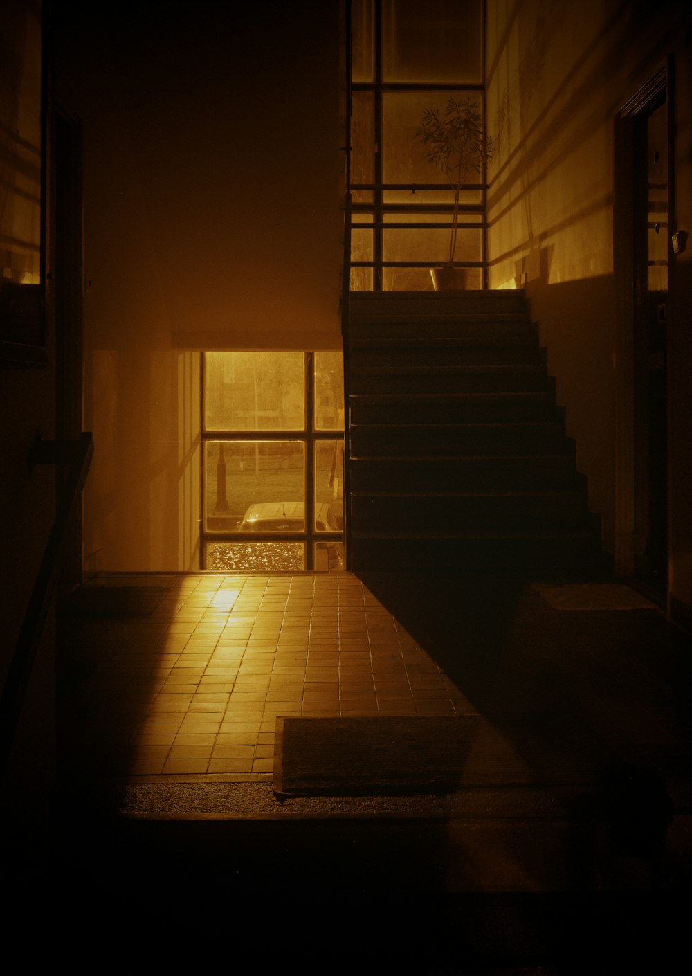 a dark room with a set of stairs