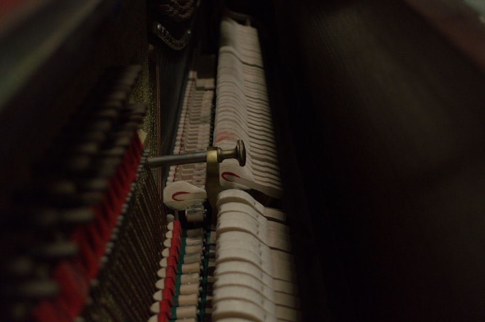 a close up of a piano with many strings