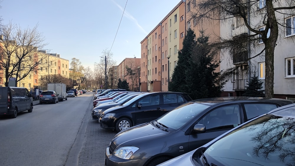 a row of parked cars on a city street