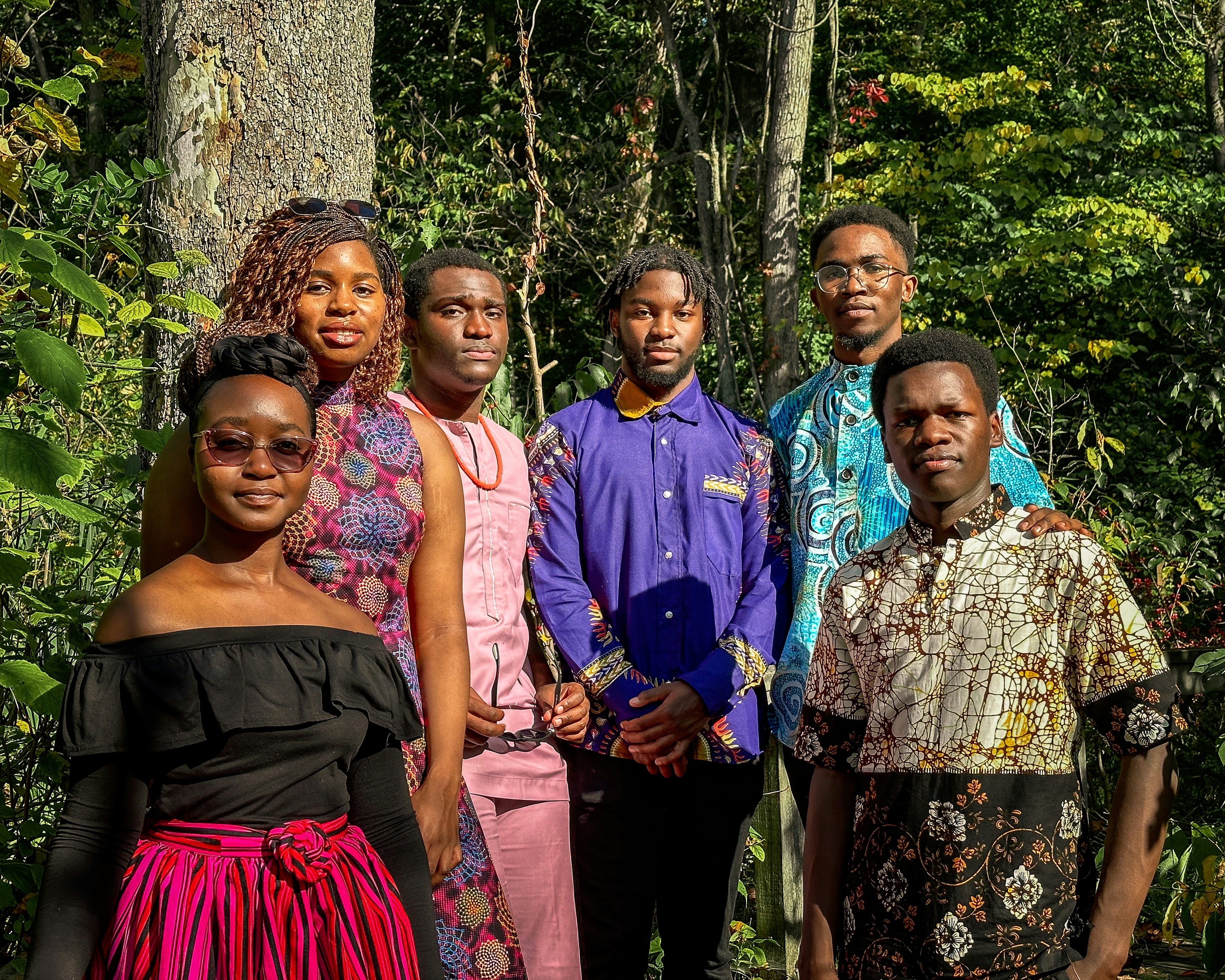 a group of people standing next to each other