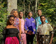 a group of people standing next to each other