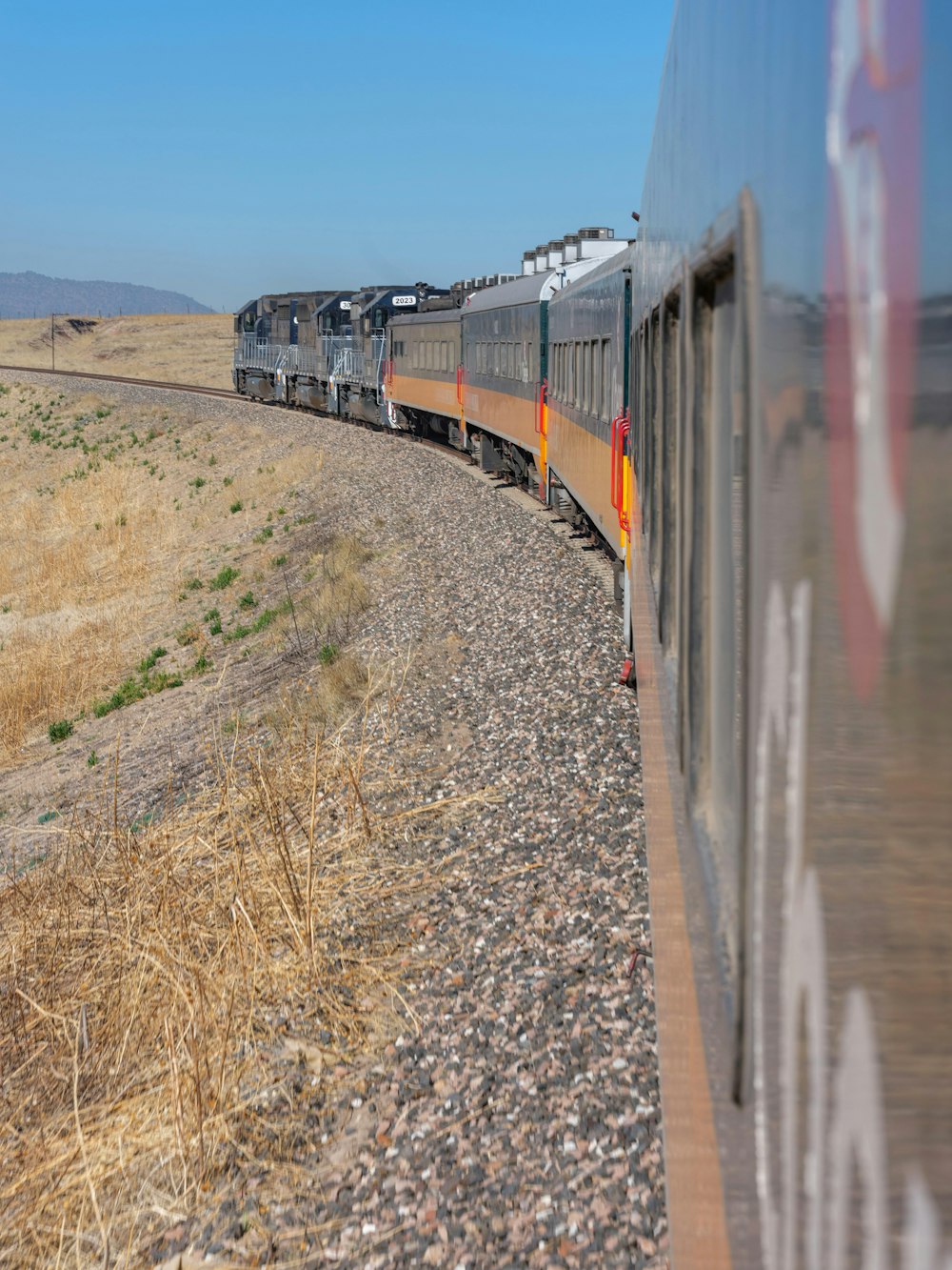 a train traveling through a rural country side