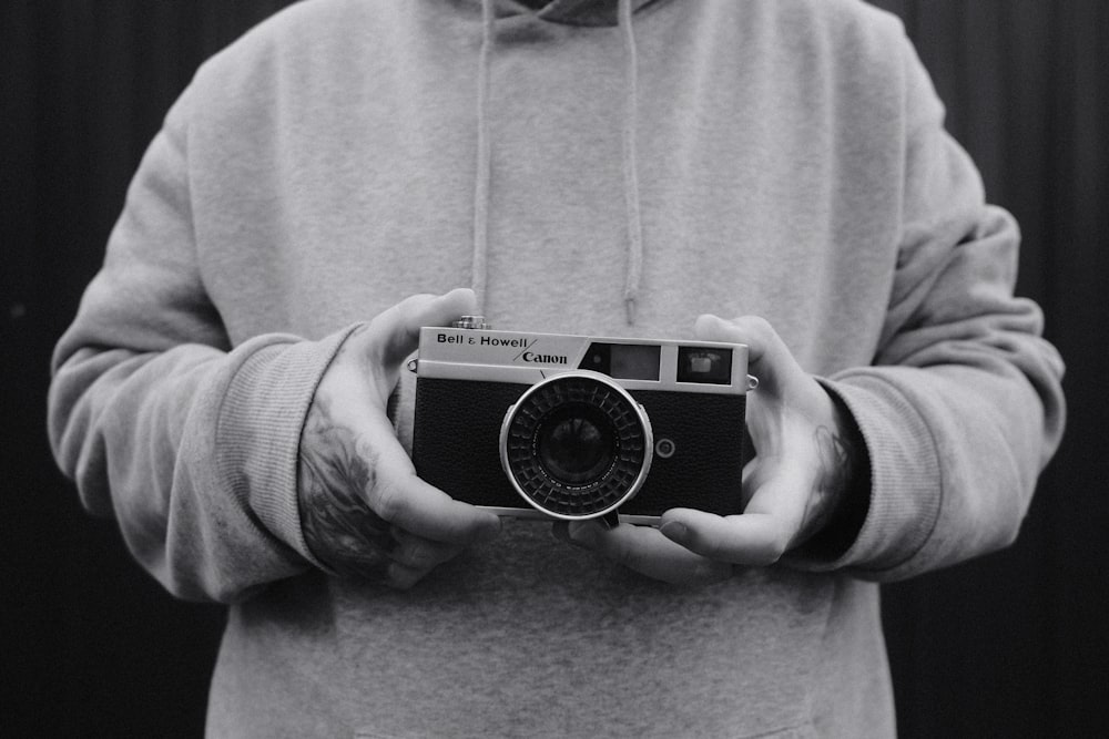 a person holding a camera in their hands