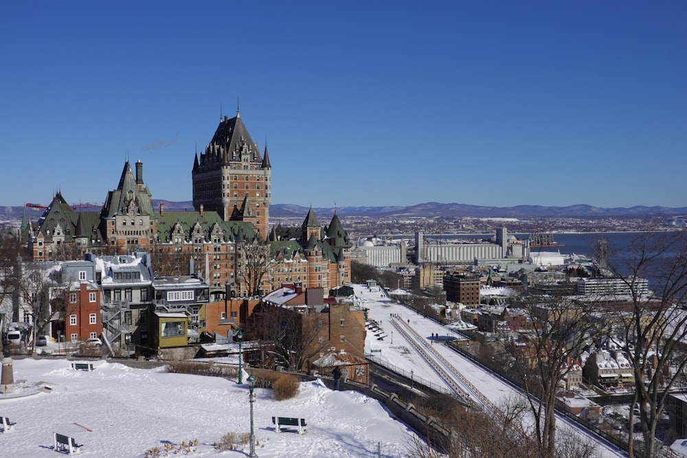 a view of a large castle in the snow