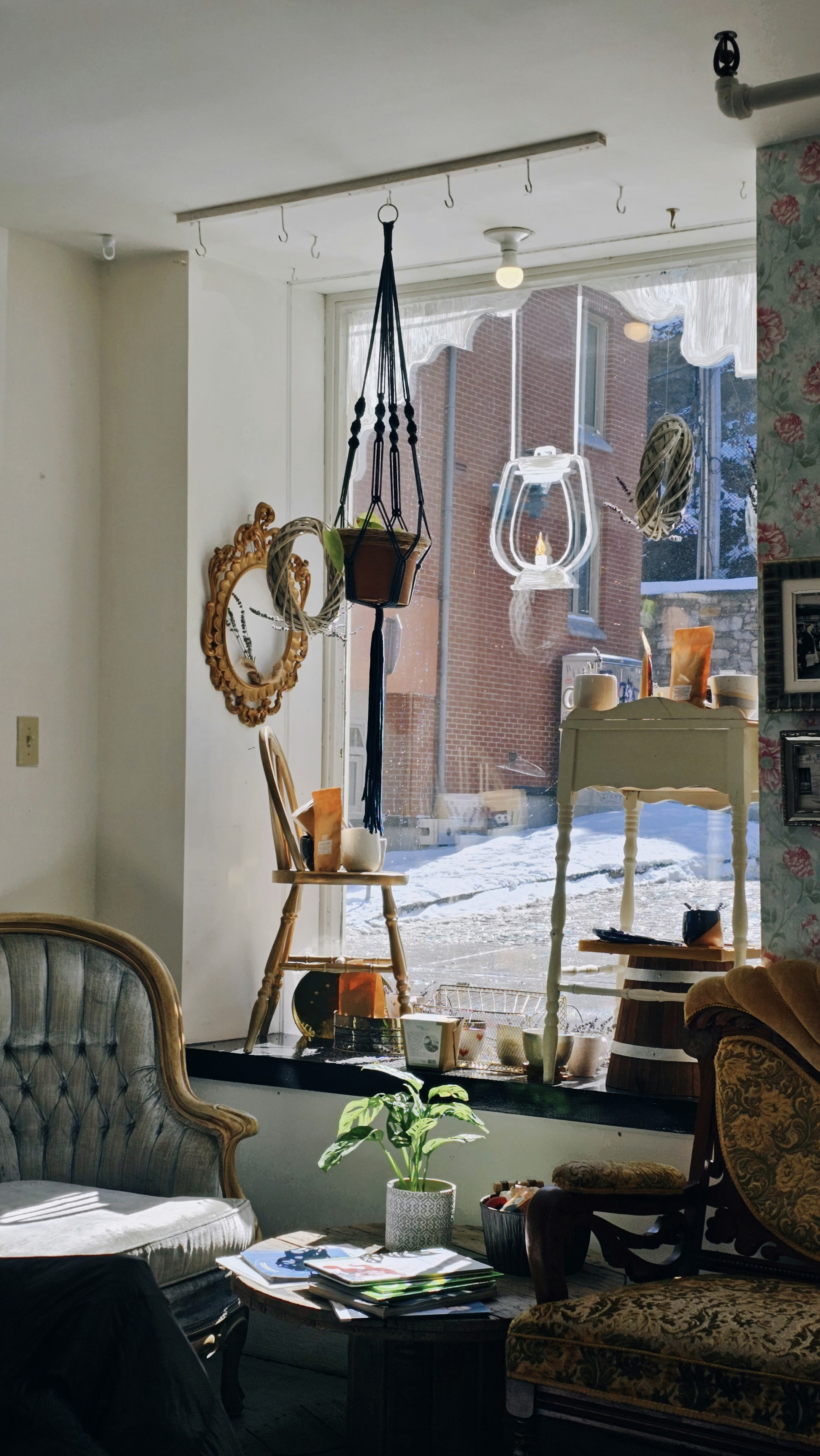 A living room filled with furniture and a large window photo Free