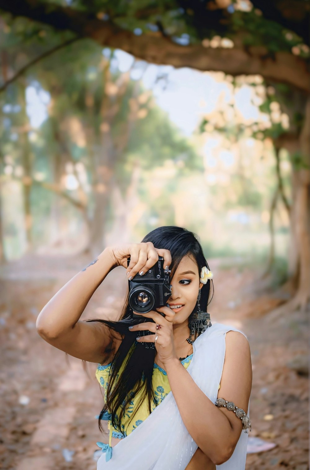 a woman taking a picture with a camera