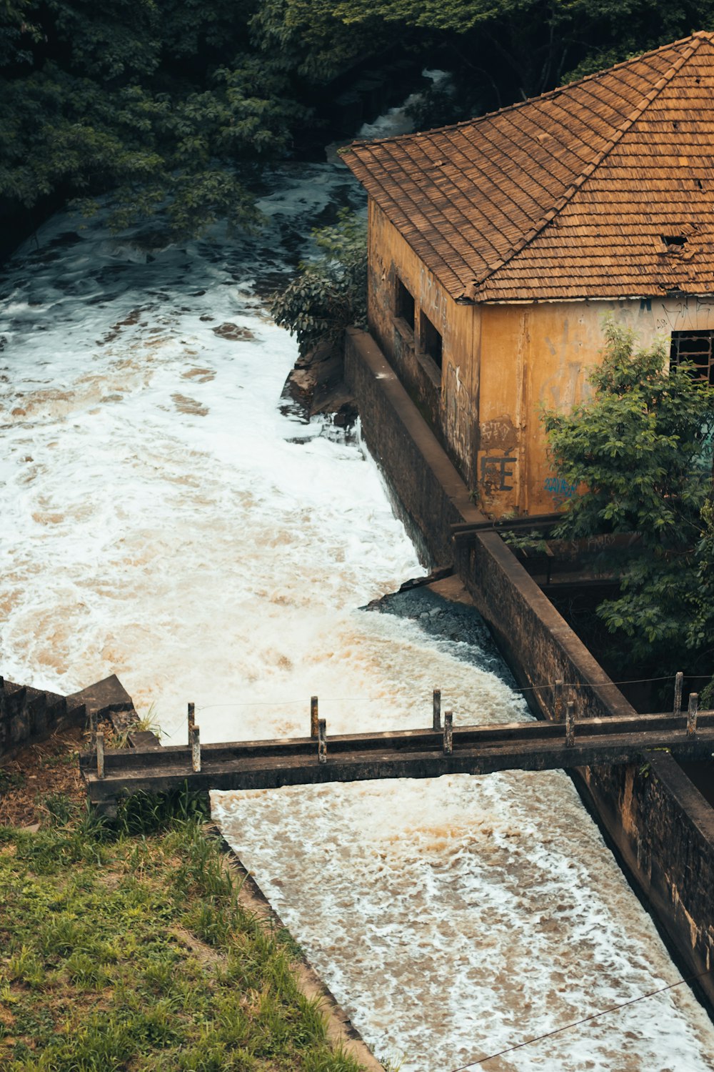 a man standing on a bridge over a river