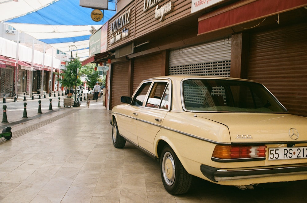 a yellow car parked on the side of a street