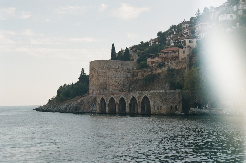 a large body of water with a castle on top of it