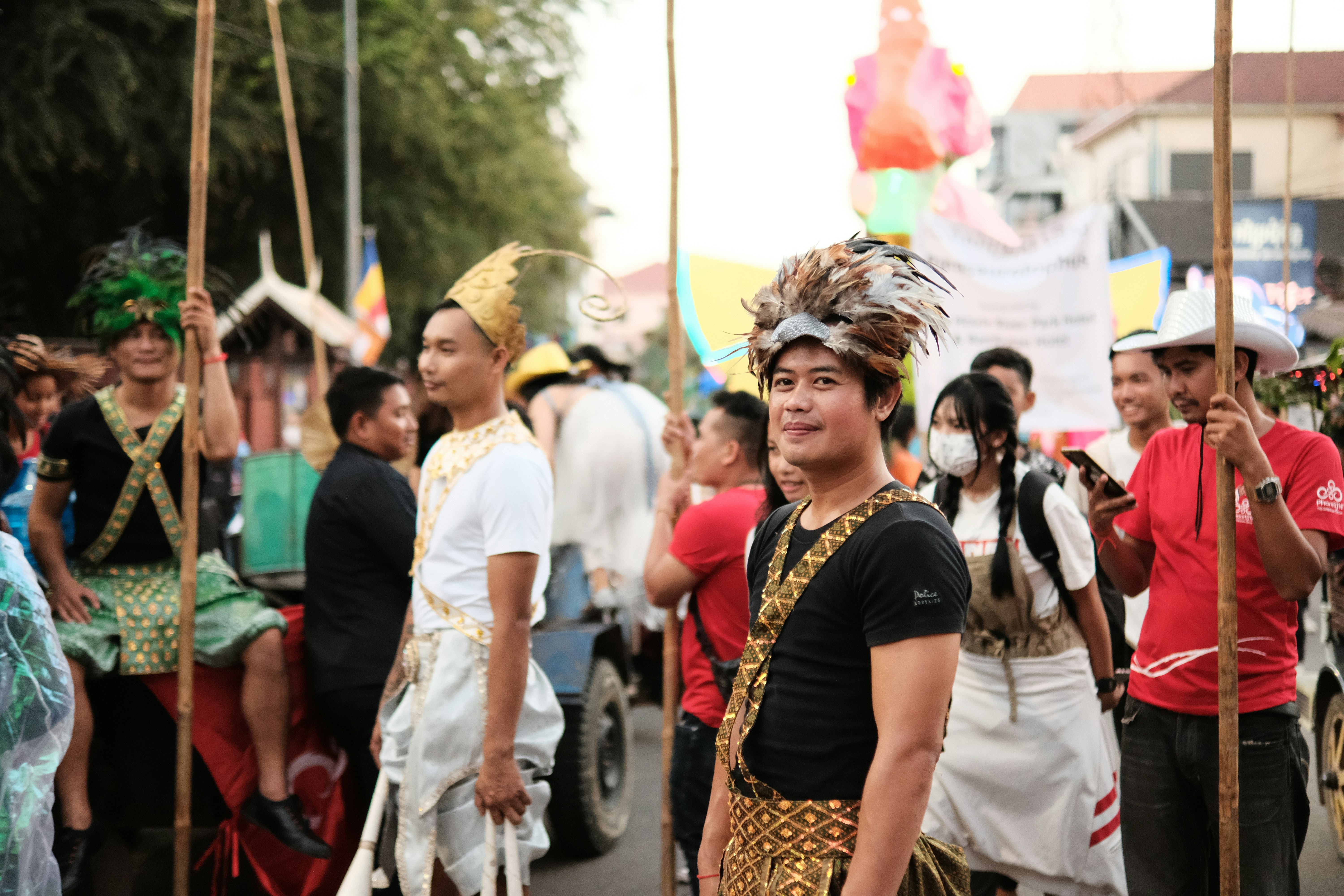 a group of people walking down a street next to each other