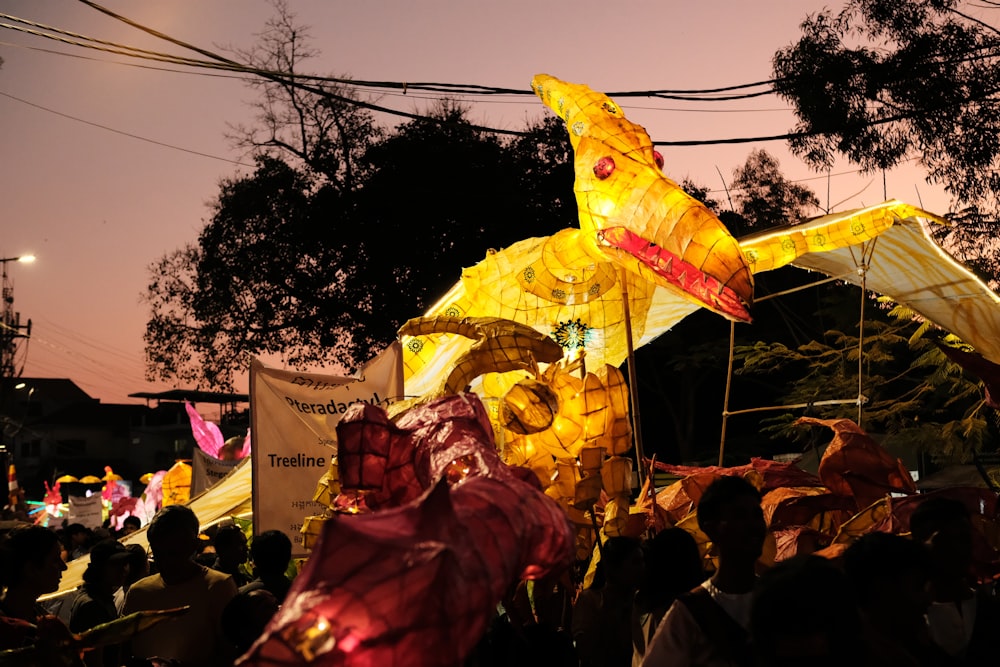 a large group of people standing around a float