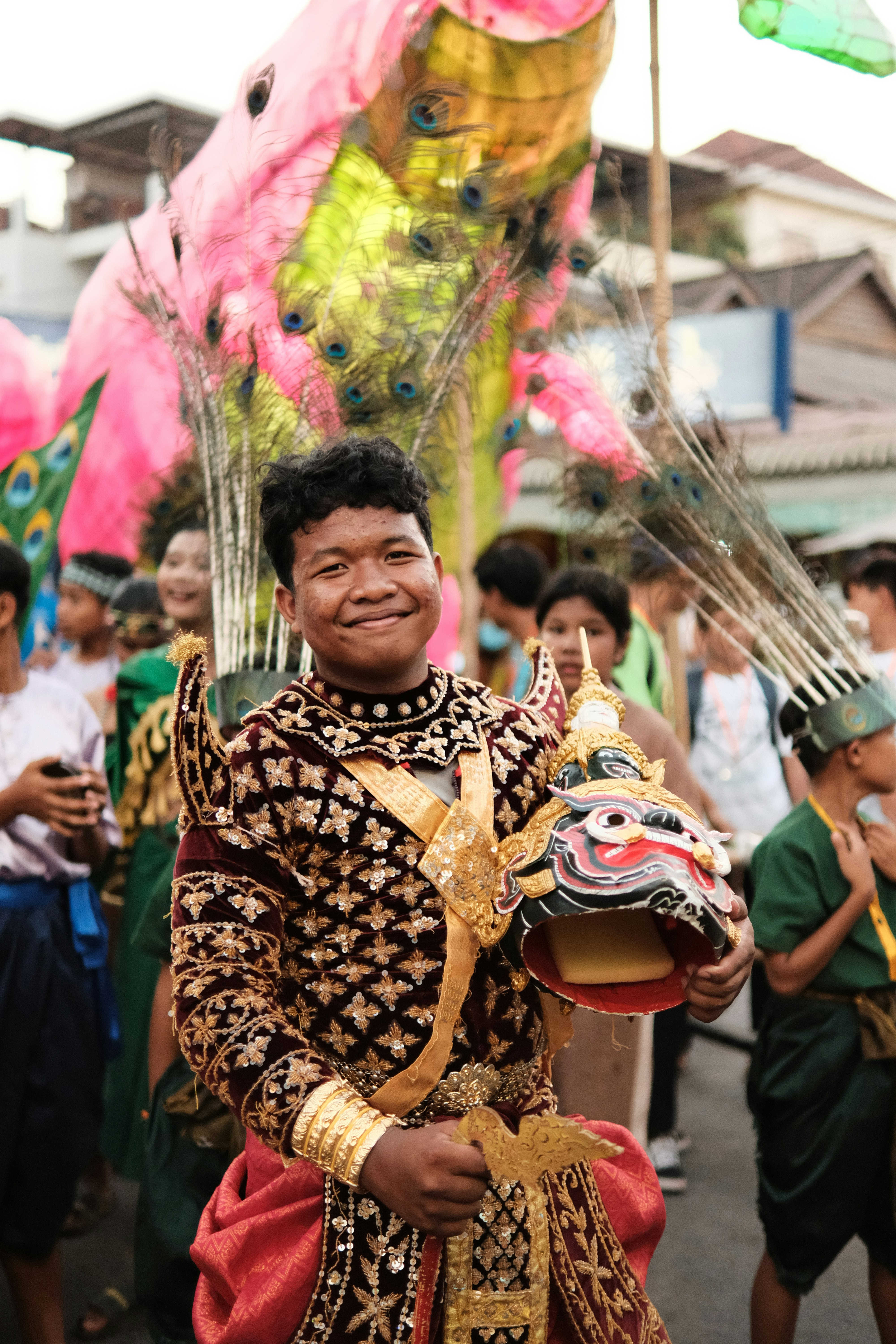 a man in a costume is holding a mask