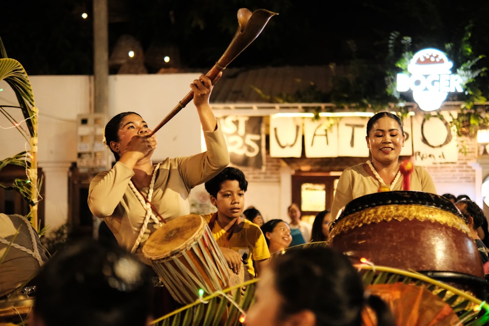 a group of people that are playing drums