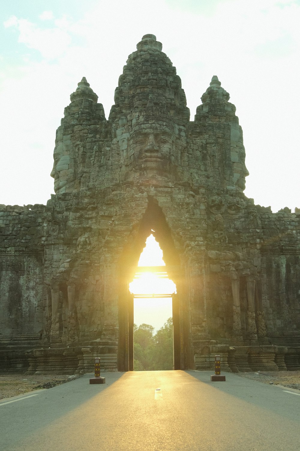 the sun is shining through a doorway in a stone building