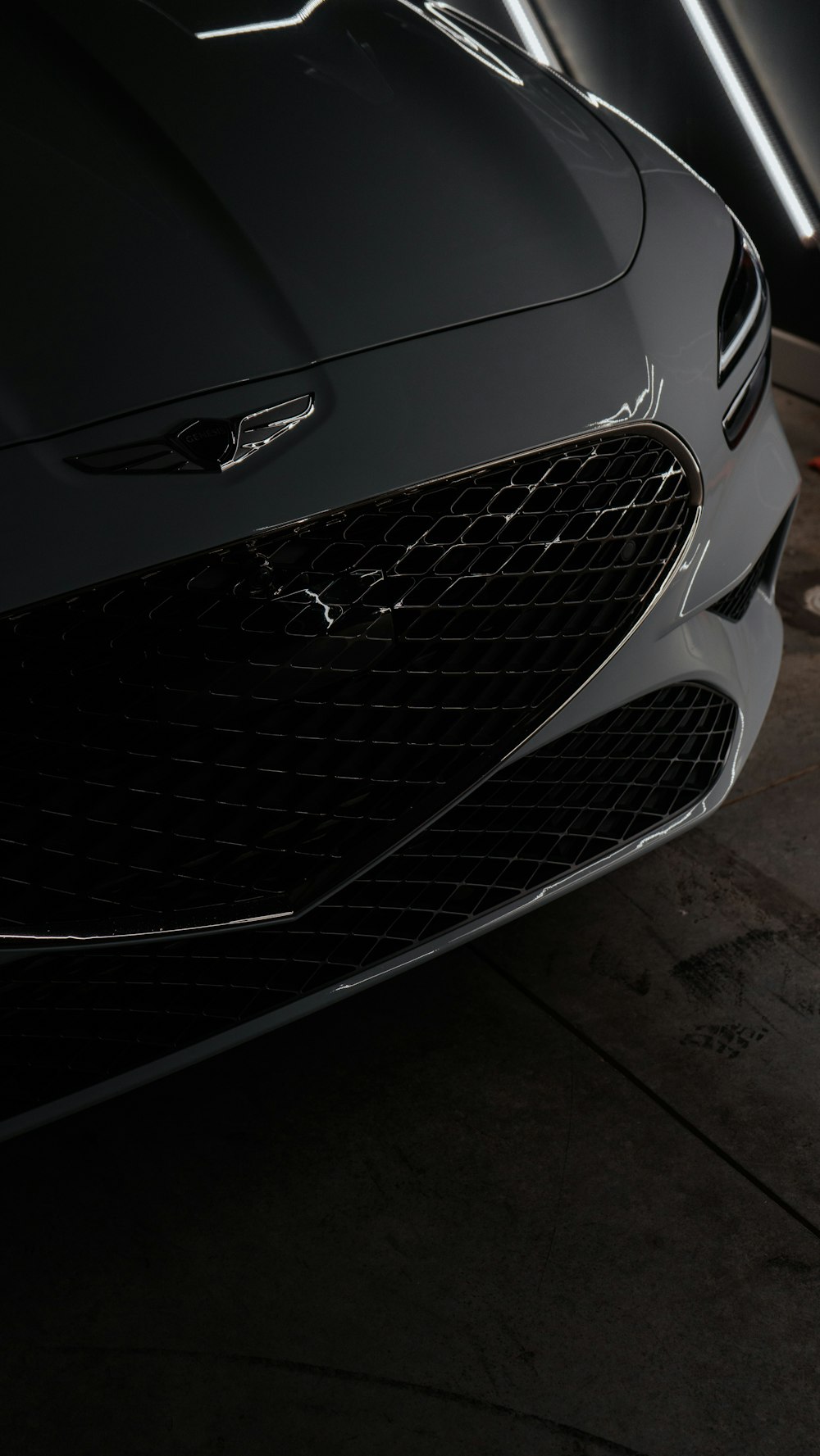 a close up of the front of a black sports car