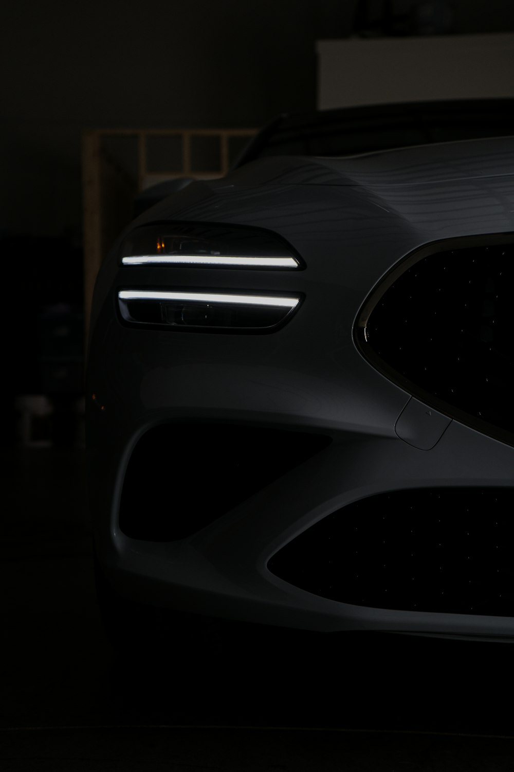 a close up of a car in a dark room