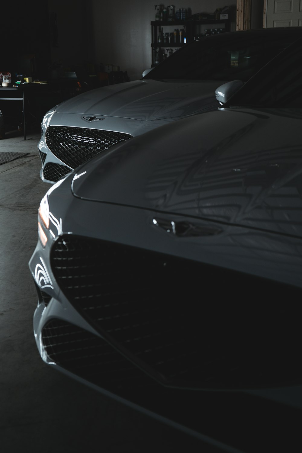 a couple of cars parked in a garage