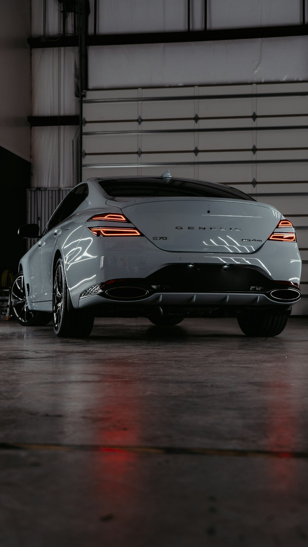 a white sports car parked in a garage