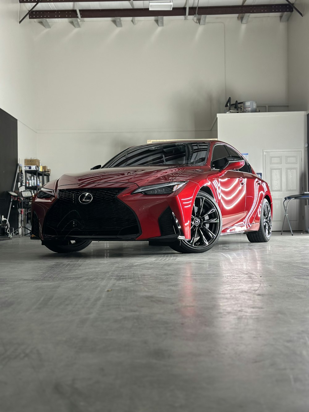 a red sports car parked in a garage