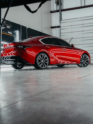 a red sports car parked in a garage