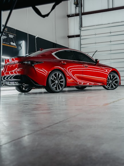 a red sports car parked in a garage