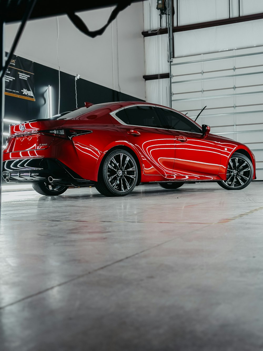 a red sports car parked in a garage