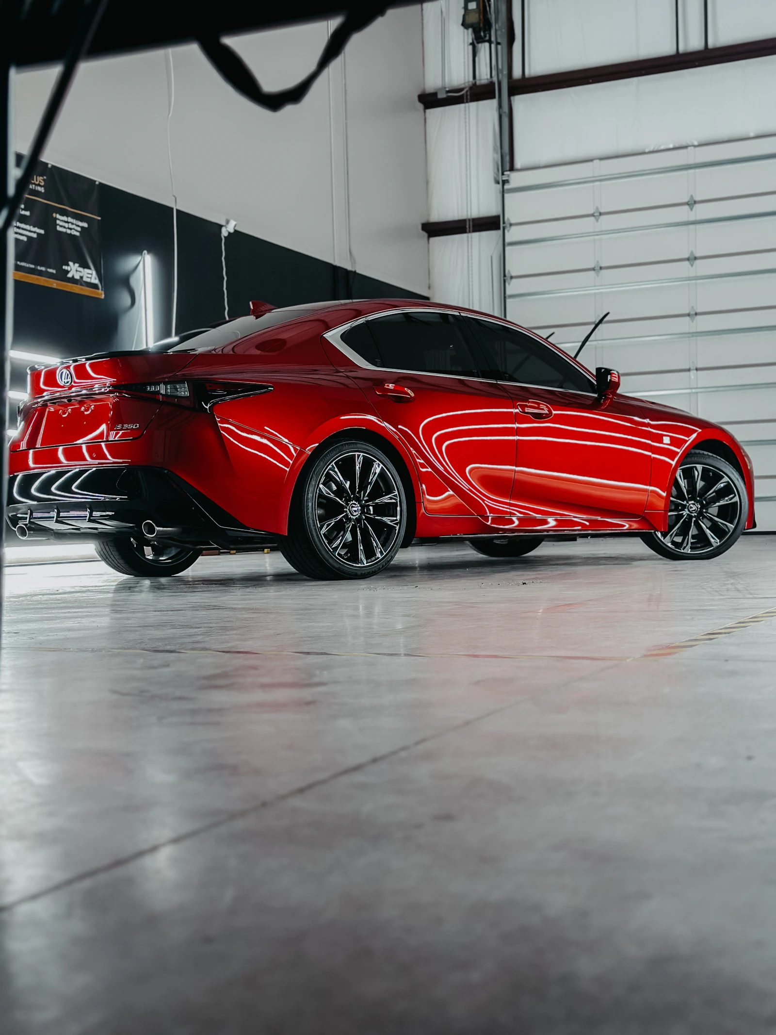 Red sports car in the studio before detailing, faded paint