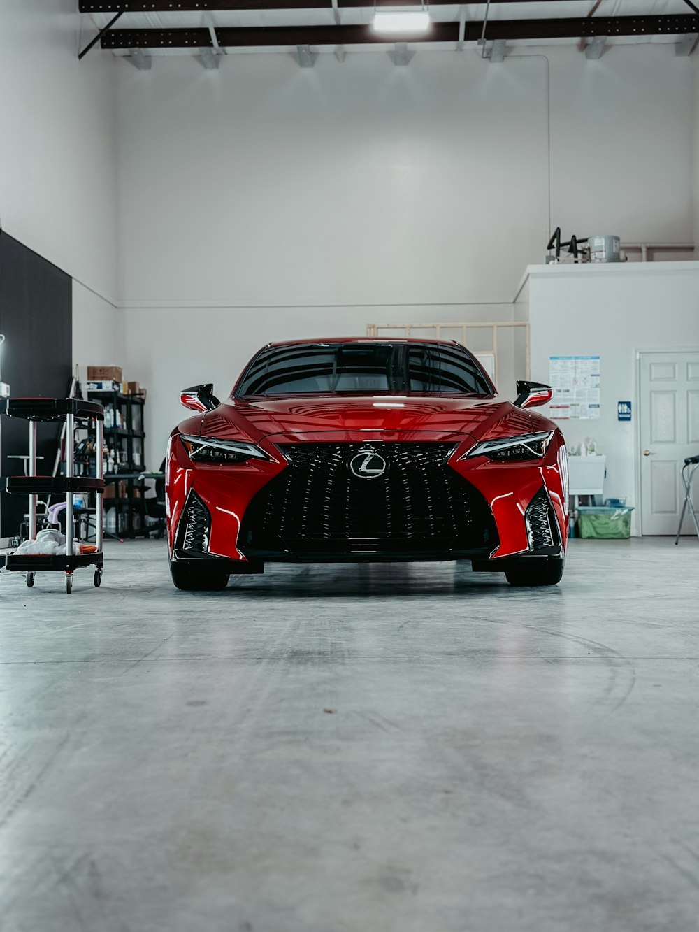 a red sports car parked in a garage