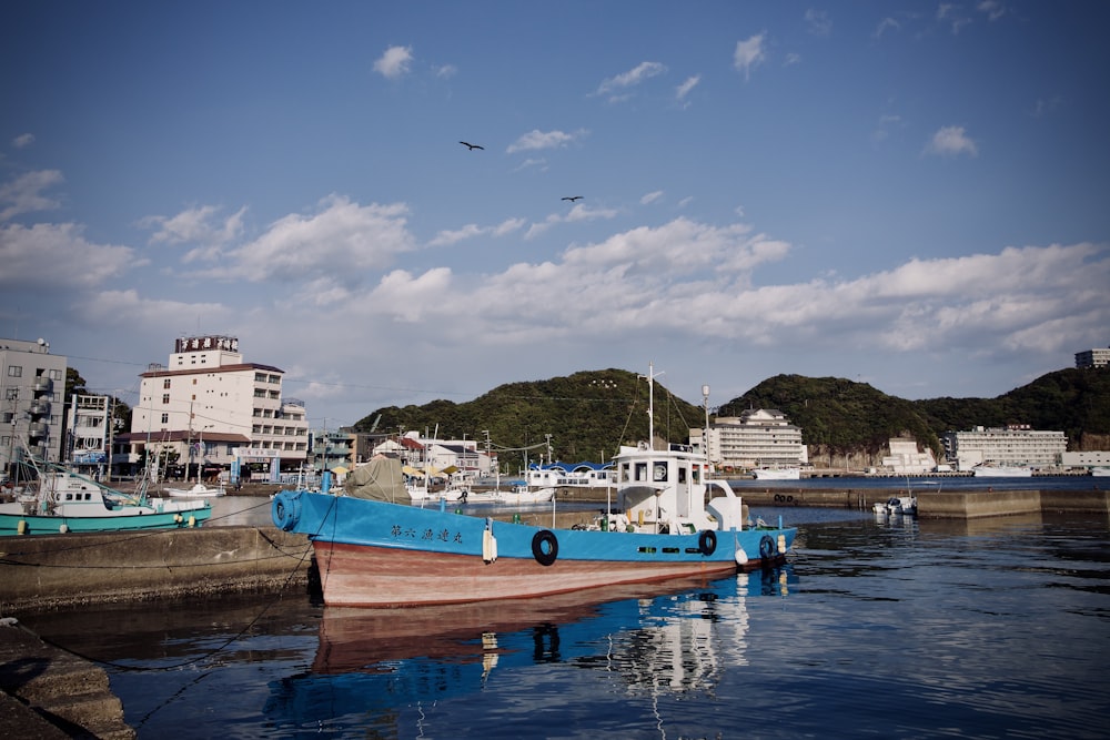 a blue and white boat in the water