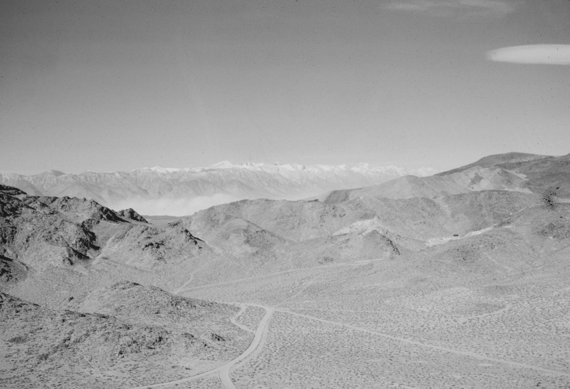 a black and white photo of a mountain range