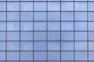 a close up view of a blue tiled wall