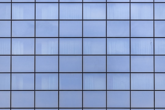 a close up view of a blue tiled wall