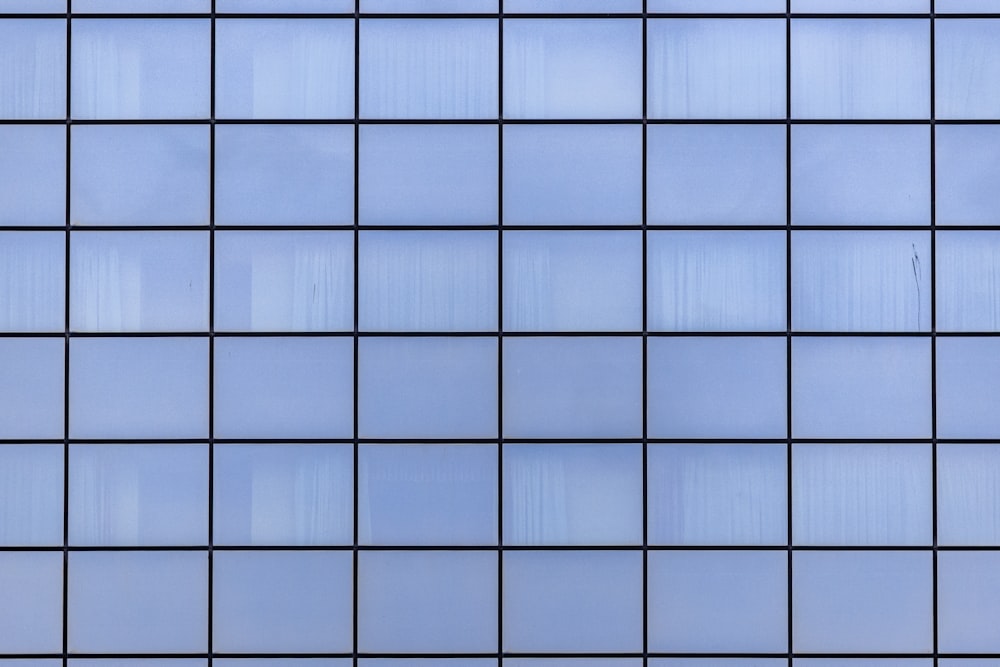 a close up view of a blue tiled wall