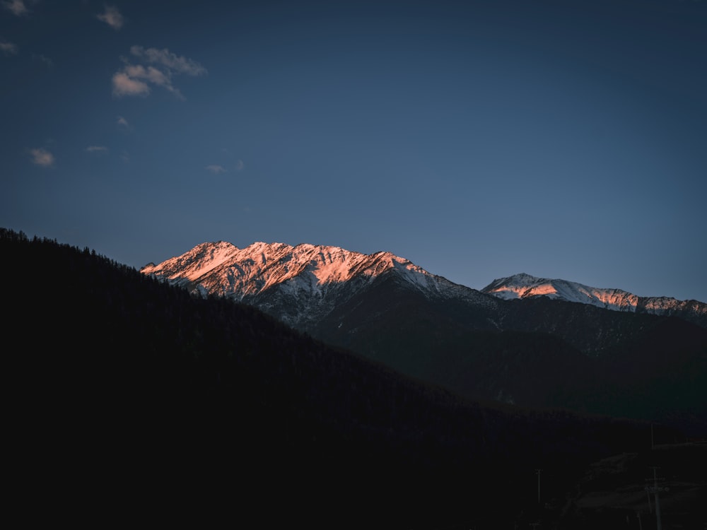 a view of a mountain range at sunset